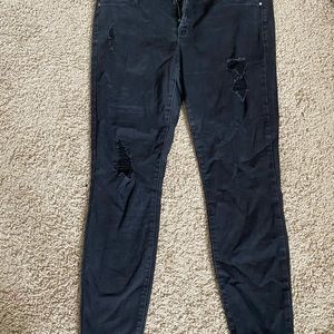 Distressed black denim jeans